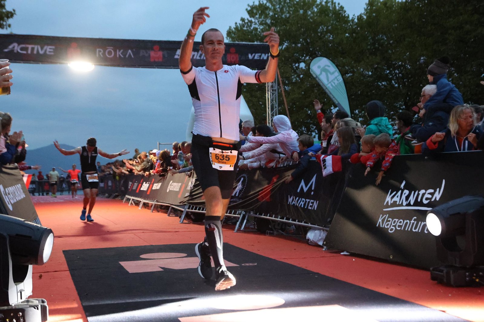 Dries Couckuyt crossing the finish line at Ironman Klagenfurt
